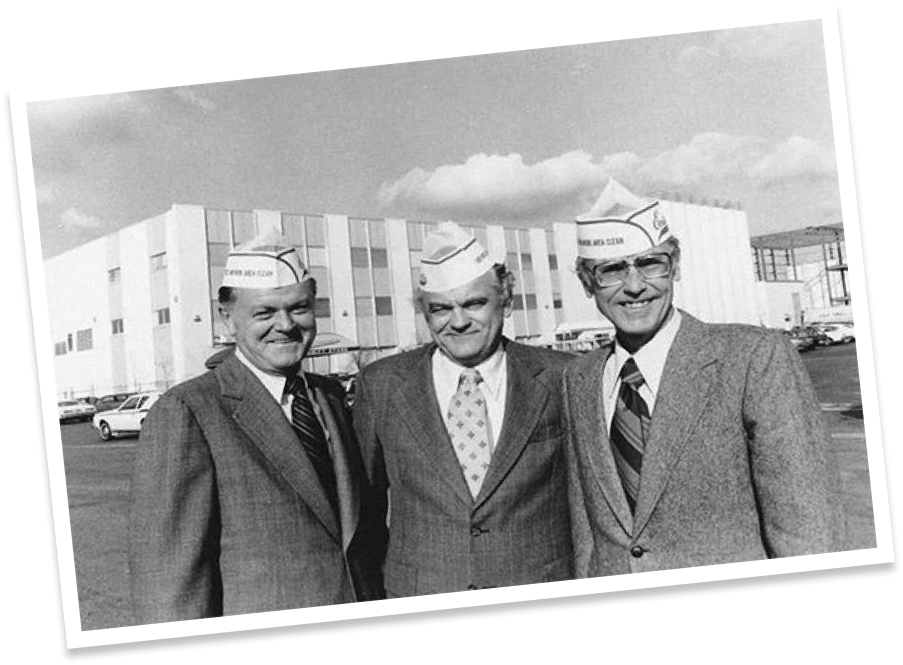 Executives standing in front of the Entenmann's baking facility c. 1961